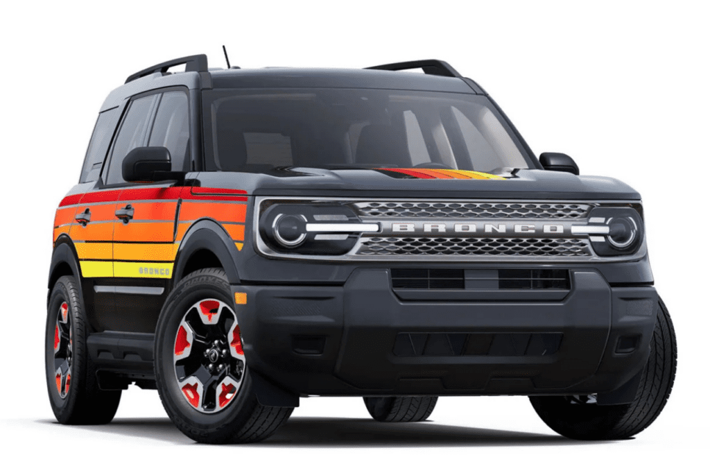 Front view of the 2025 Ford Bronco Sport Free Wheeling edition in black with retro red, orange, and yellow stripes, highlighting its vibrant throwback design inspired by the 1970s