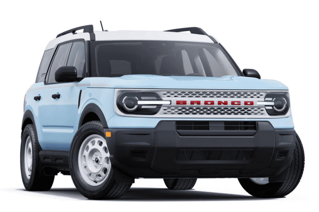 Front view of the 2025 Ford Bronco Sport Heritage Edition in Robin's Egg Blue with white accents, displaying its retro-inspired styling and classic Bronco grille.