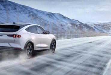 2025 Ford Mustang Mach E driving in the snow