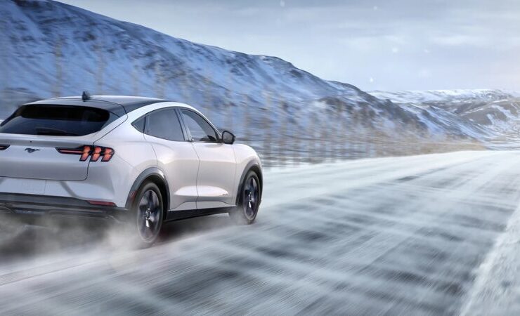 2025 Ford Mustang Mach E driving in the snow