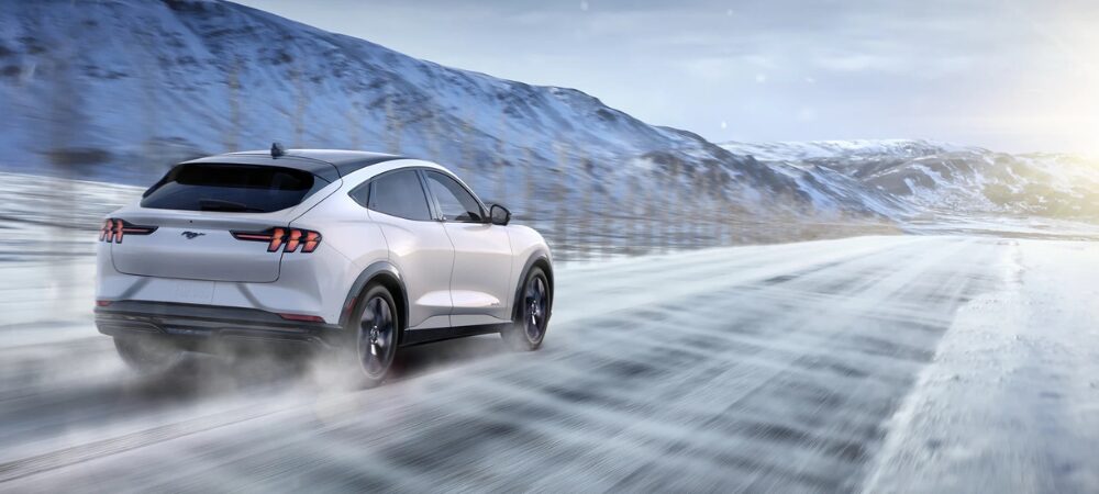 2025 Ford Mustang Mach E driving in the snow