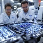 Ford EV battery pack with technicians in laboratory setting