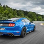 Blue Ford Mustang GTD racing on Nürburgring track