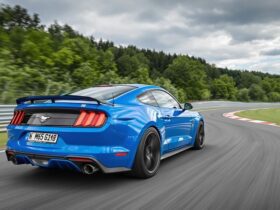 Blue Ford Mustang GTD racing on Nürburgring track