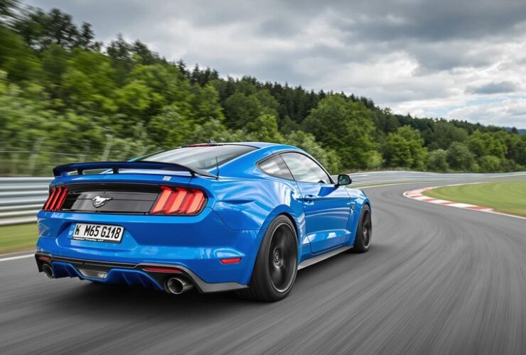Blue Ford Mustang GTD racing on Nürburgring track
