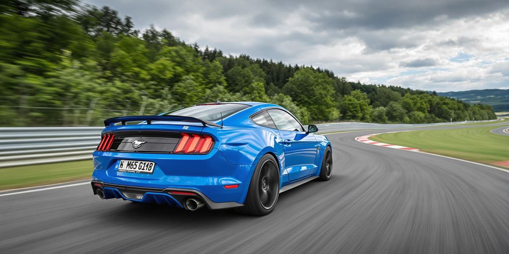 Blue Ford Mustang GTD racing on Nürburgring track