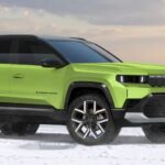 Bright green Jeep Compass EV parked on a snowy landscape, showcasing its modern design and electric SUV styling against a cloudy sky backdrop.